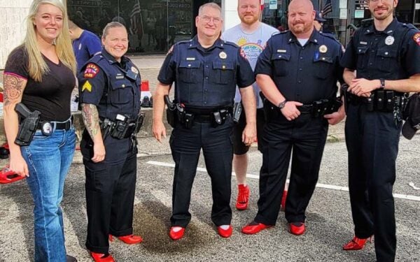 Why are these cops wearing red high heels? - photo licensed by shore news network.