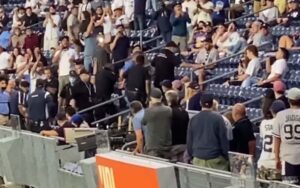 The new america: yankee fans handcuffed, escorted out of stadium for "trump won" banner