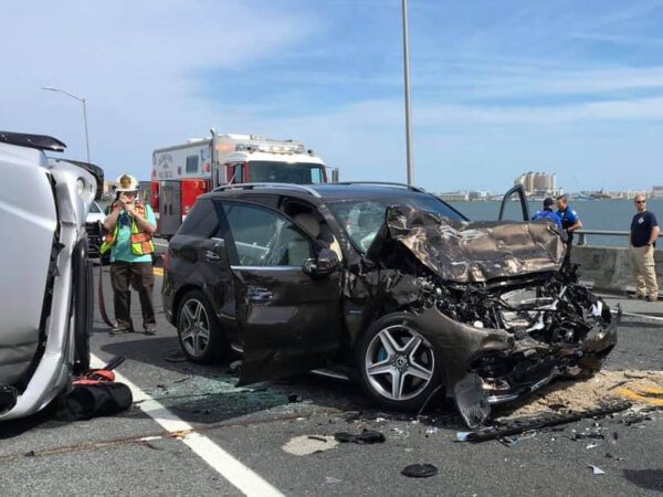Man dives into water after baby ejected off bridge in multi-car crash