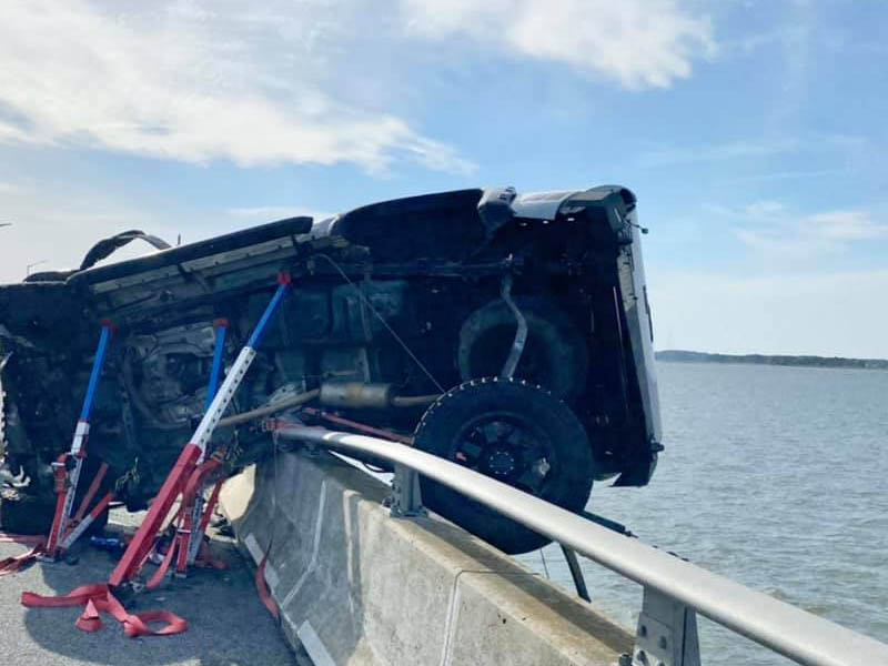 Man dives into water after baby ejected off bridge in multi-car crash