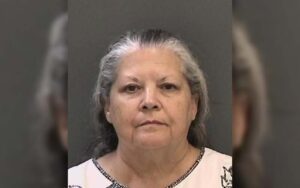 Woman charged with abuse of dead body