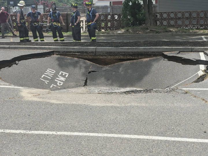 Car nearly swallowed by a massive sinkhole near Route 35 in Wall