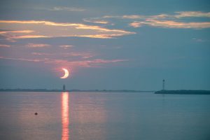 Rare morning eclipse as seen from lewes beach in delaware