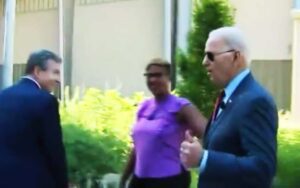 Presidential handlers usher confused biden away from reporters