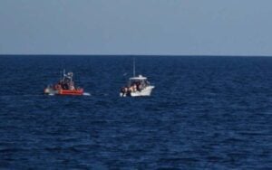 Coast guard rescues four from sinking boat off coast near wachapreague inlet