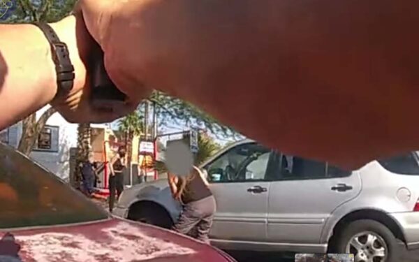 Police shoot and kill armed black man holding gun, turns he was just trying to stop criminals - photo licensed by shore news network.