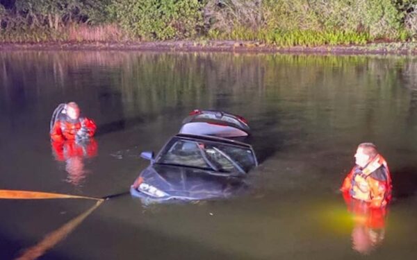 Car pulled from pond in cheval - photo licensed by shore news network.