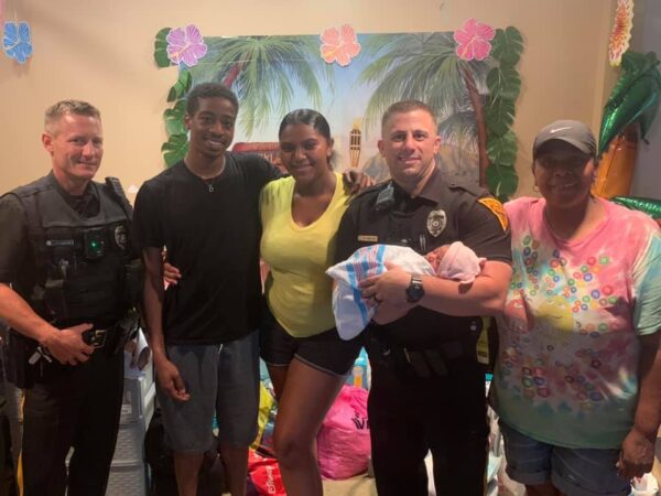Evesham police officers visit baby after helping mom with delivery - photo licensed by shore news network.