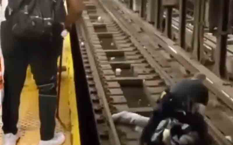 NYPD officers rescue man who fell onto subway tracks as the train approached