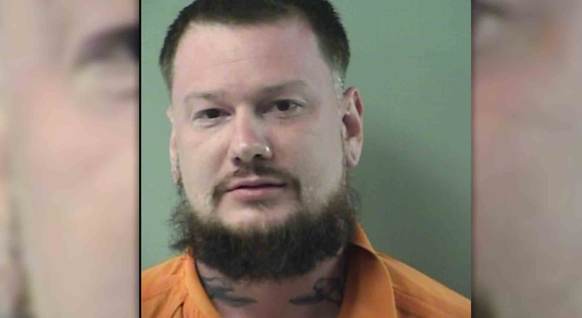 Man pulls gun in road rage after being honked at for making illegal turn