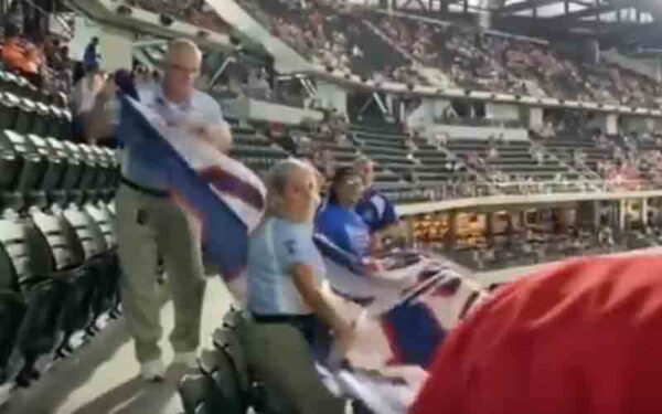 Texas ranger fan ejected after unfurling "trump won" flag during baseball game - photo licensed by shore news network.