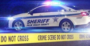 Responding to car crash in west palm beach, police find man dead from gunshot wounds
