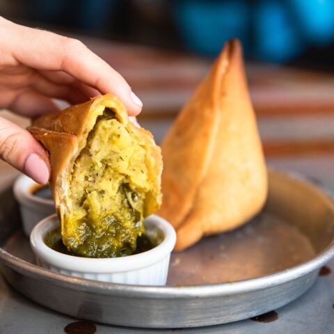 Curry up now celebrates world vegetarian day with free samosas for customers - photo licensed by shore news network.