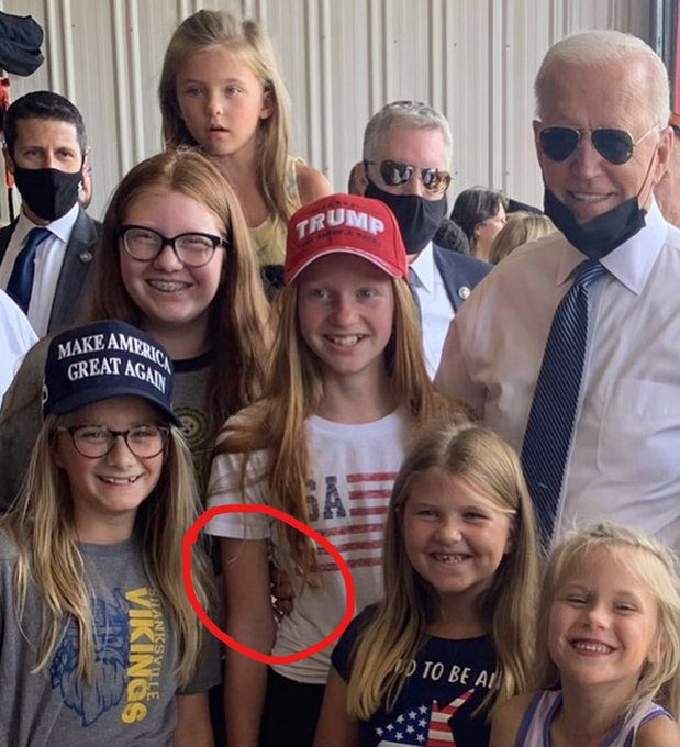 Joe Biden poses with kids wearing Trump shirts and hats during 9-11 visit