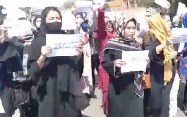Taliban special forces shut down women's rights protest with guns drawn - photo licensed by shore news network.