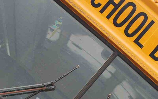 Private school bus driver charged after crashing busload of students into house