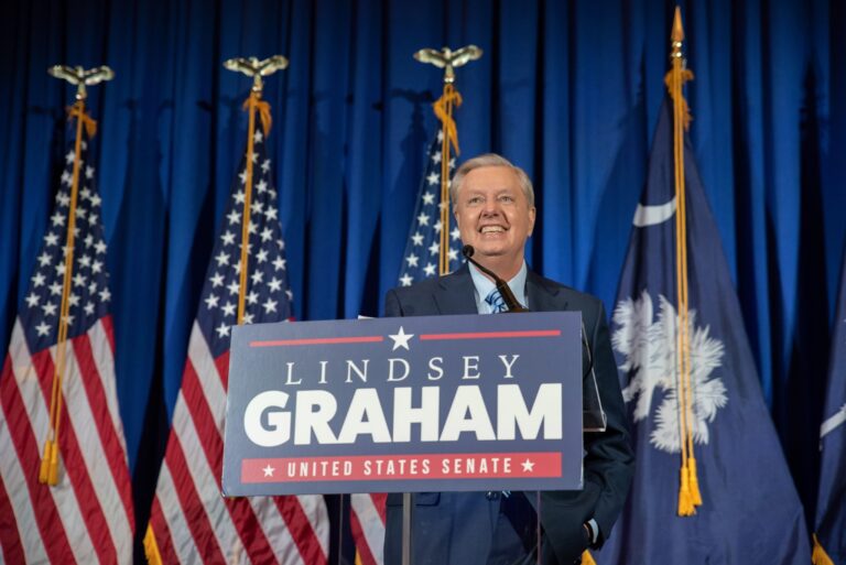 Lyndsey graham gets heckled at his own fundraiser by anti-vax supporters - photo licensed by shore news network.