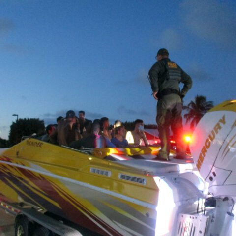 Police discover over 30 migrants hiding in a boat during routine traffic stop in florida - photo licensed by shore news network.