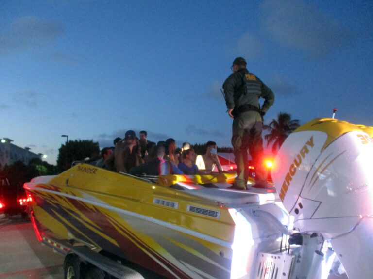 Police discover over 30 migrants hiding in a boat during routine traffic stop in florida - photo licensed by shore news network.