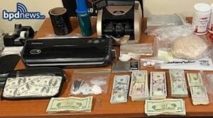 Search warrant in dorchester leads to the recovery of drugs and cash and arrest