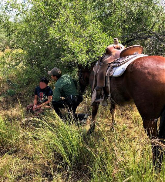 On horses U.S. Border Patrol agents rescue migrant lost in rough desert terrain