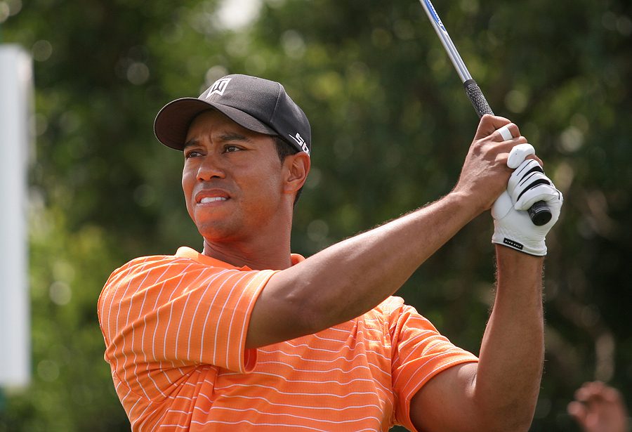 Two charged for scamming sports tourists out of $126,000 trip to see Tiger Woods