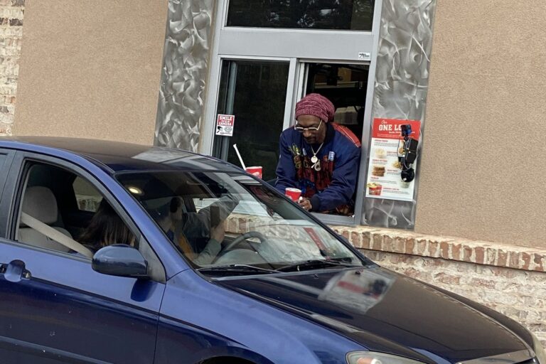 Nothing to see here except for Snoop Dogg serving fried chicken at the drive-thru window