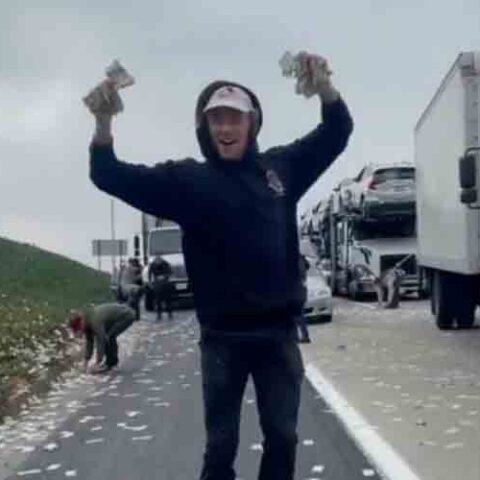 Freeway littered after money flies out of bags from armored truck - photo licensed by shore news network.