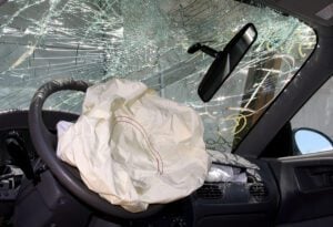 Woman fights off carjacker after stopping to help injured motorist