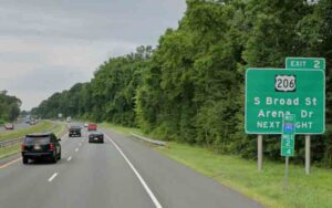 Guns, drugs recovered, 14 arrested after i-195 party bus traffic stop