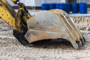 Tractor-trailer driver issued summons after excavator he was hauling fell on car in toms river
