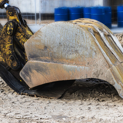 Tractor-trailer driver issued summons after excavator he was hauling fell on car in toms river - photo licensed by shore news network.
