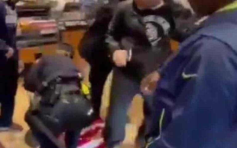 New york police officers throw american flag on the ground, arrest unvaccinated man after trying to order food at panera bread - photo licensed by shore news network.