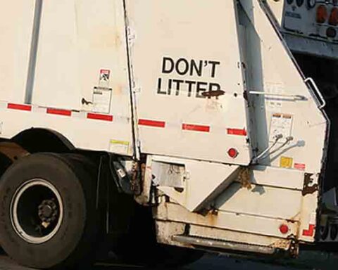 A garbage truck during its collection route - File Photo