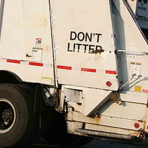 A garbage truck during its collection route - file photo