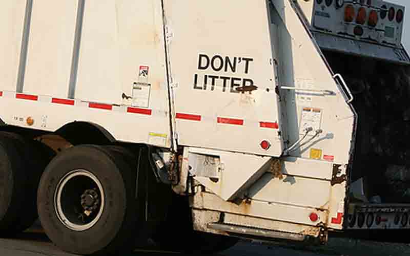 A garbage truck during its collection route - File Photo