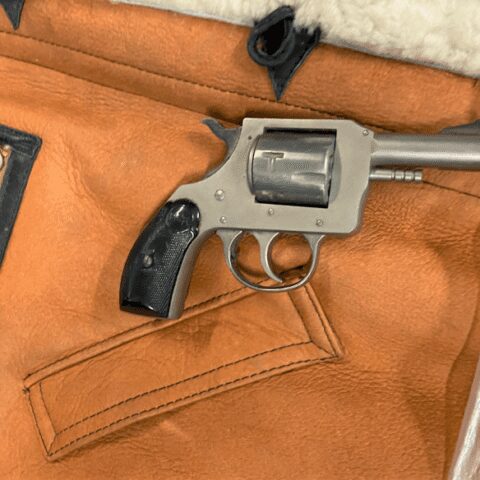 Woman arrested by police after tsa catches her with a handgun in her coat pocket at a philadelphia international airport - photo licensed by shore news network.