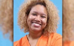 Woman Accused Of Killing Boyfriend With A Sword Smiles During Mugshot