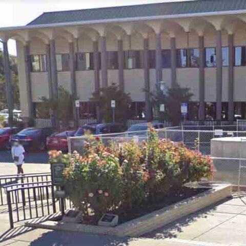 Bad idea: gunman points gun at six cops outside stockton police communications center - photo licensed by shore news network.