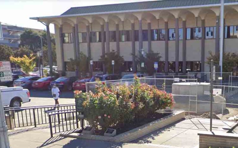 Bad idea: gunman points gun at six cops outside stockton police communications center - photo licensed by shore news network.