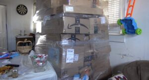 Authorities arrest three christmas porch pirates after thousands of stolen packages found inside home