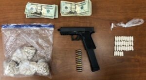 Drug investigation leeds to recovery of handgun and heroin in baltimore