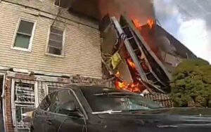 Watch: new york police officers rescue woman trapped under debris in bronx home explosion