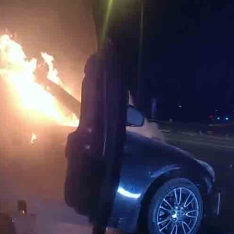 Watch as police officer rescues woman from burning car - photo licensed by shore news network.