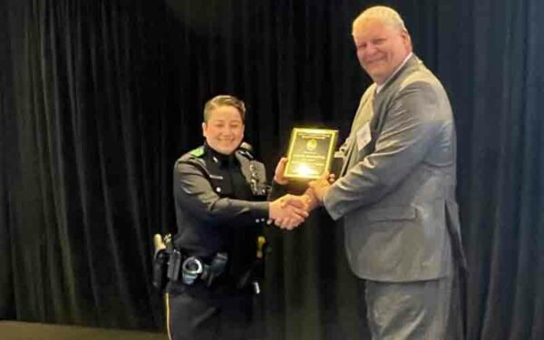 Female officer recognized as dallas "officer of the month" - photo licensed by shore news network.
