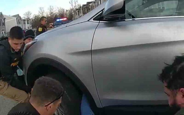 Hero cops literally lift car off woman trapped underneath
