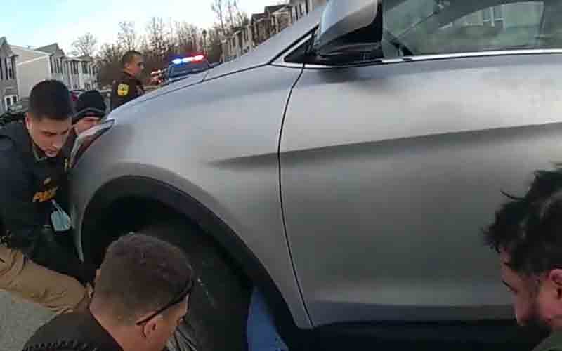 Hero cops literally lift car off woman trapped underneath