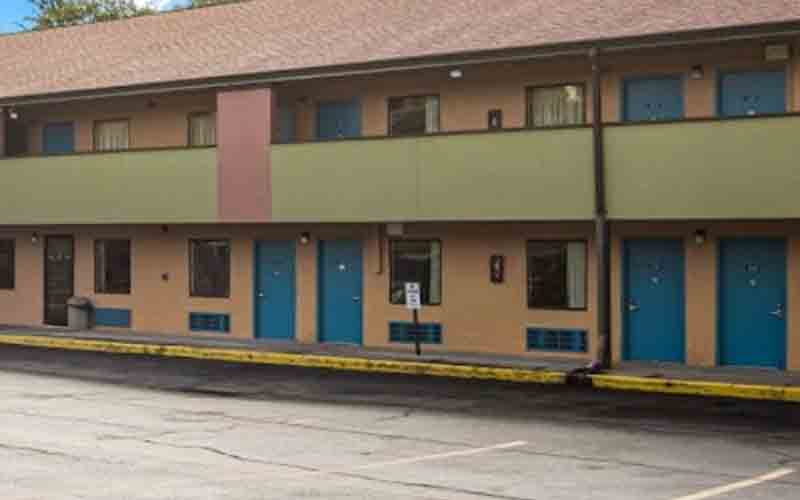 Pool of blood outside motel room leads police to mutilated, murdered woman's body