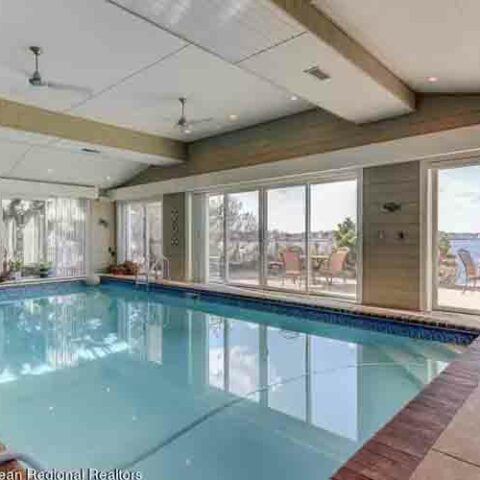 This $3. 1 million waterfront home for sale in toms river even has an indoor pool - photo licensed by shore news network.