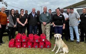 New orleans police department receives donation of doggie first aid kits to serve community